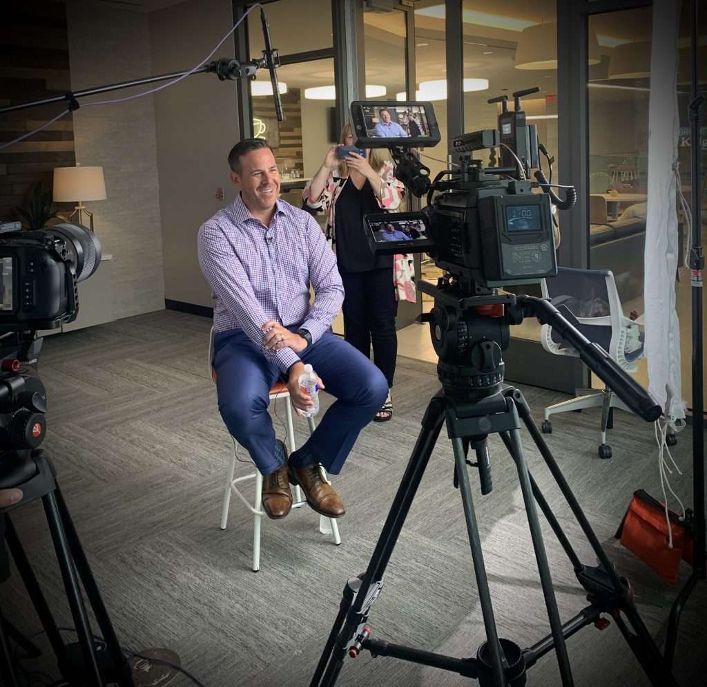 image of a financial advisor being interviewed on camera